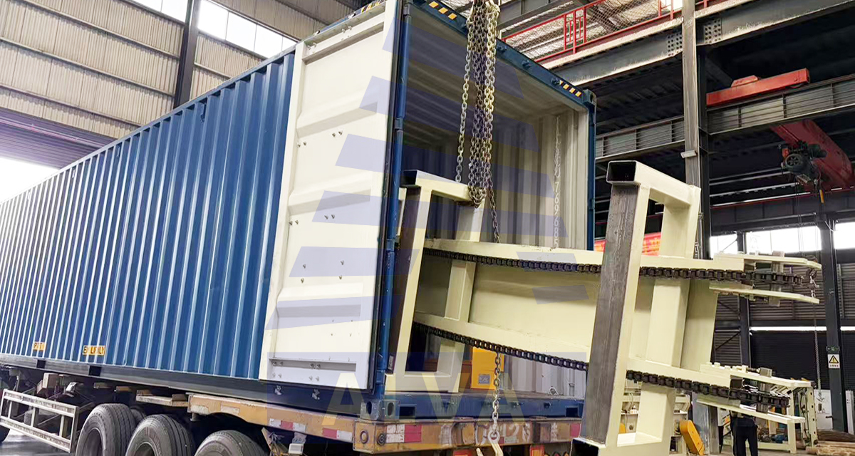`Workers loading wood‑processing machinery into containers for European project`